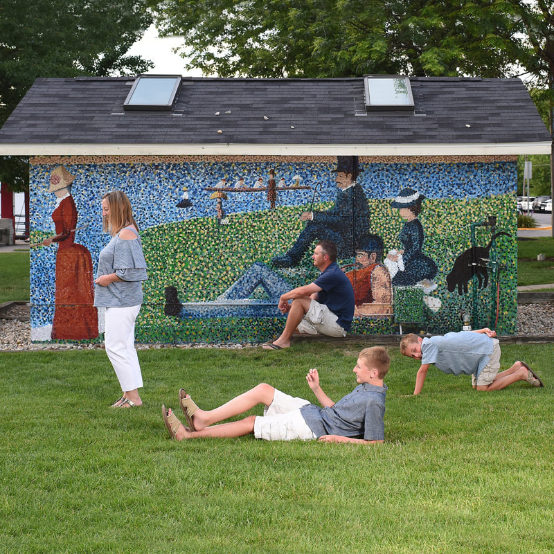 People relaxing on the lawn at Wicks Park