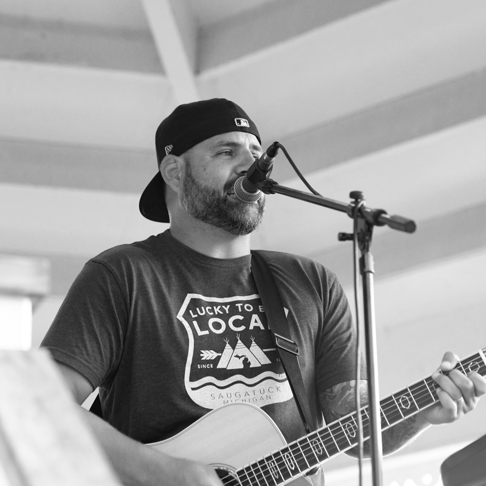A musician performing at Music in the Park