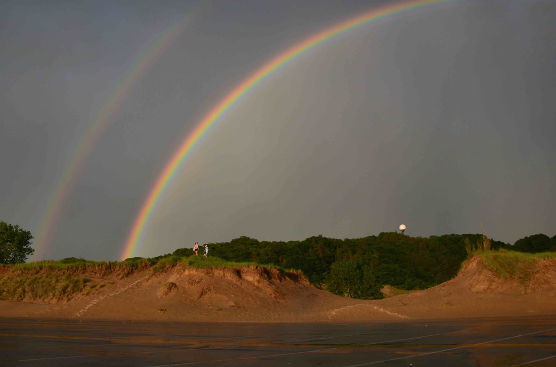 A rainbow over the dunes of the Saugatuck Harbor Natural Area